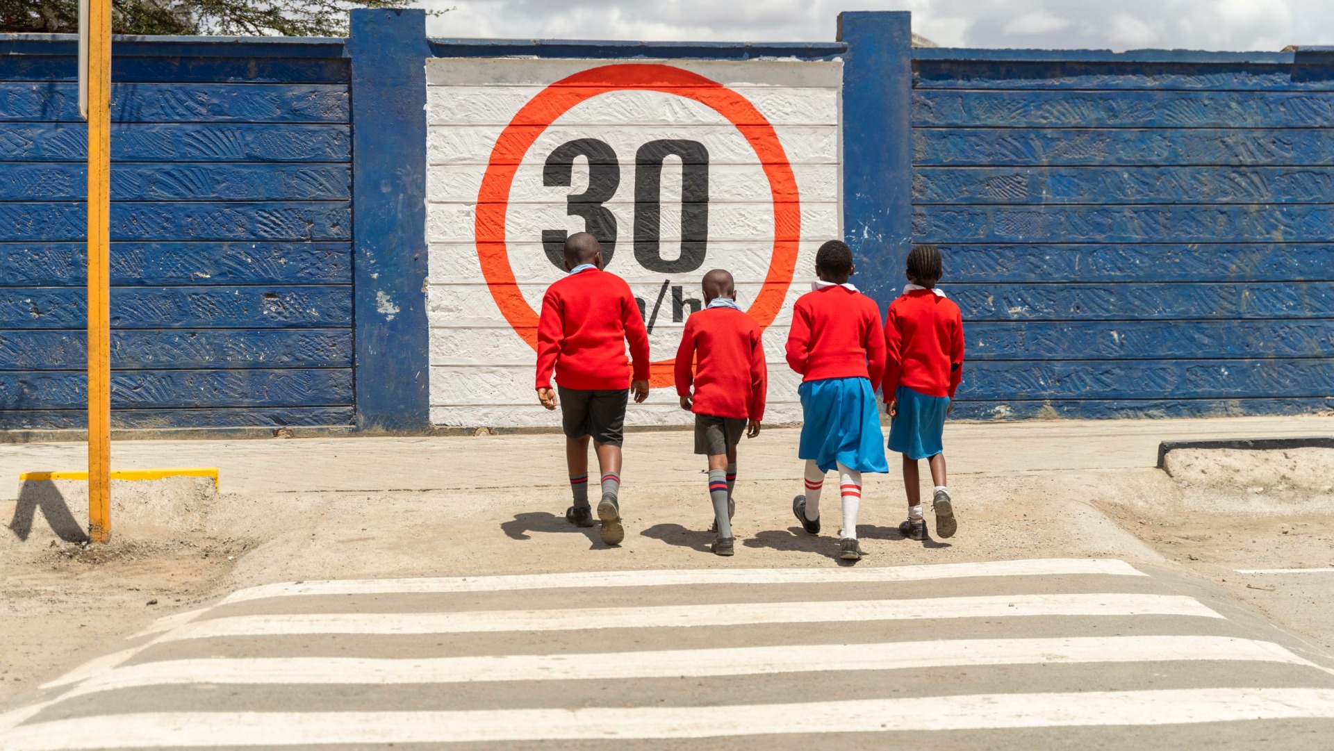 Learners use one of the new raised crossings outside Mwangaza Primary School in Kayole, Nairobi